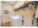 Convenient laundry room with washer, dryer, and shelving at 12822 Rainwashed Loop, Parrish, FL 34219