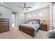 Main bedroom with a large bed and plenty of light at 12822 Rainwashed Loop, Parrish, FL 34219