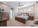 Main bedroom with large bed and plenty of storage at 12822 Rainwashed Loop, Parrish, FL 34219