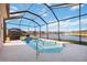 Relaxing screened pool with water feature and lake view at 12822 Rainwashed Loop, Parrish, FL 34219