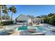 Modern pool design with water features and backyard basketball hoop at 1302 Roberts Bay Ln, Sarasota, FL 34242