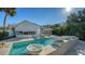 Stunning pool area featuring elegant water features and lush tropical landscaping at 1302 Roberts Bay Ln, Sarasota, FL 34242