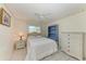 Cozy bedroom with white woven furniture and a ceiling fan at 1346 Queen Rd, Venice, FL 34293