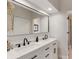 Modern bathroom with double vanity and marble countertop at 14018 Pine Woods E Ln, Sarasota, FL 34240