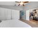 Main bedroom with walk-in closet and ceiling fan at 14018 Pine Woods E Ln, Sarasota, FL 34240