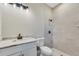 Bathroom with white vanity, marble countertop and shower at 144 Spring Dr, Rotonda West, FL 33947