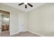 Light and airy bedroom with wood-look floors and access to bathroom at 144 Spring Dr, Rotonda West, FL 33947