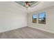 Bedroom with shiplap accent wall and wood-look floors at 144 Spring Dr, Rotonda West, FL 33947