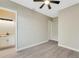 Bedroom with wood-look floors and access to bathroom at 144 Spring Dr, Rotonda West, FL 33947