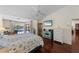 Spacious bedroom with pool access and hardwood floors at 1441 Gleneagles Dr, Venice, FL 34292