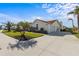 Single-story home with attached garage and nicely landscaped yard at 1441 Gleneagles Dr, Venice, FL 34292