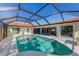 Enclosed pool with lake view and patio at 1441 Gleneagles Dr, Venice, FL 34292