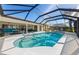 Enclosed heated pool with patio and lake view at 1441 Gleneagles Dr, Venice, FL 34292