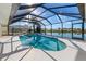 Heated pool with screened enclosure and lake view at 1441 Gleneagles Dr, Venice, FL 34292