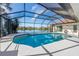 Enclosed heated pool with lake view at 1441 Gleneagles Dr, Venice, FL 34292