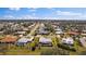 Aerial view of a residential neighborhood with houses and pools at 157 Da Vinci Dr, Nokomis, FL 34275