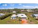 Aerial view of house, driveway and surrounding landscape at 157 Da Vinci Dr, Nokomis, FL 34275