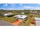 Aerial view of house, driveway and surrounding landscape at 157 Da Vinci Dr, Nokomis, FL 34275