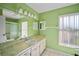 Bathroom with marble vanity top and a large mirror at 157 Da Vinci Dr, Nokomis, FL 34275