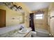 Bathroom with bathtub and marble vanity top at 157 Da Vinci Dr, Nokomis, FL 34275