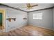 Bedroom with wood floors and built-in shelving at 157 Da Vinci Dr, Nokomis, FL 34275