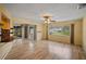 Living room with light walls, wood floors, and a view to the backyard at 157 Da Vinci Dr, Nokomis, FL 34275