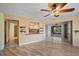 Living room with wood-look floors, and views to the kitchen and backyard at 157 Da Vinci Dr, Nokomis, FL 34275