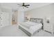 Bright, clean bedroom featuring a queen bed, and two nightstands with lots of light at 1671 Mellon Way, Sarasota, FL 34232