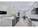 Contemporary kitchen featuring a large island, stainless steel appliances, and an open layout at 1671 Mellon Way, Sarasota, FL 34232