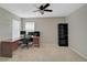 Spacious office area with desk, shelves, and natural light from two windows at 1671 Mellon Way, Sarasota, FL 34232