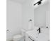 Clean powder room featuring a modern vanity, a mirror, and a toilet at 1671 Mellon Way, Sarasota, FL 34232