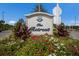 Well-maintained community entrance sign for The Retreat, surrounded by flowers at 16730 Collingtree Xing, Lakewood Ranch, FL 34202