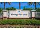 Elegant community entrance sign for Country Club East, surrounded by lush greenery at 16730 Collingtree Xing, Lakewood Ranch, FL 34202