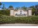 Elegant community sign surrounded by lush landscaping and mature trees at 16730 Collingtree Xing, Lakewood Ranch, FL 34202