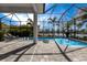 Screened-in pool and patio area with outdoor seating and views of the surrounding landscaping and water features at 16730 Collingtree Xing, Lakewood Ranch, FL 34202