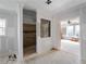 An unfinished bathroom features tiled shower with accent wall, and natural light at 17555 Lake Worth Blvd, Port Charlotte, FL 33948