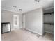 Unfinished bedroom featuring gray walls, closet doors, and access to other rooms at 17555 Lake Worth Blvd, Port Charlotte, FL 33948