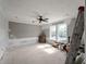 Bedroom with bright windows and a ceiling fan in an unfinished space at 17555 Lake Worth Blvd, Port Charlotte, FL 33948