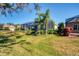 Landscaped backyard with tropical plants and patio at 2006 Red Lake Run, Bradenton, FL 34211