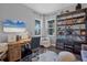 Home office with built-in shelving and a large desk at 2006 Red Lake Run, Bradenton, FL 34211