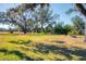 Spacious lot with mature trees and grassy area at 2006 Red Lake Run, Bradenton, FL 34211