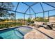 Large screened pool with seating area at 2006 Red Lake Run, Bradenton, FL 34211