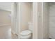 Neutral bathroom features tile flooring, toilet, and shower with glass door at 20313 Navajo Ln, Port Charlotte, FL 33952