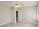 Spacious bedroom with ceiling fan, closet and easy access to the bathroom at 20313 Navajo Ln, Port Charlotte, FL 33952