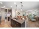 Kitchen island with double sink and a view of the living room at 220 Alfero Way, Nokomis, FL 34275