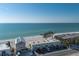 Fantastic aerial shot highlighting the property's location near the sandy beach and clear ocean waters at 2310 Gulf N Dr # 201, Bradenton Beach, FL 34217