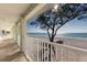 Relaxing balcony view overlooking a beautiful sandy beach and the ocean at 2310 Gulf N Dr # 201, Bradenton Beach, FL 34217