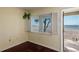 Bedroom with a gorgeous water view and access to a private balcony at 2310 Gulf N Dr # 201, Bradenton Beach, FL 34217