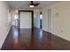 Spacious living room with wood floors, views into the kitchen, and access to other rooms at 2310 Gulf N Dr # 201, Bradenton Beach, FL 34217