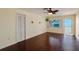 The living room includes wood floors, closet, views, and decorative wall hangings at 2310 Gulf N Dr # 201, Bradenton Beach, FL 34217